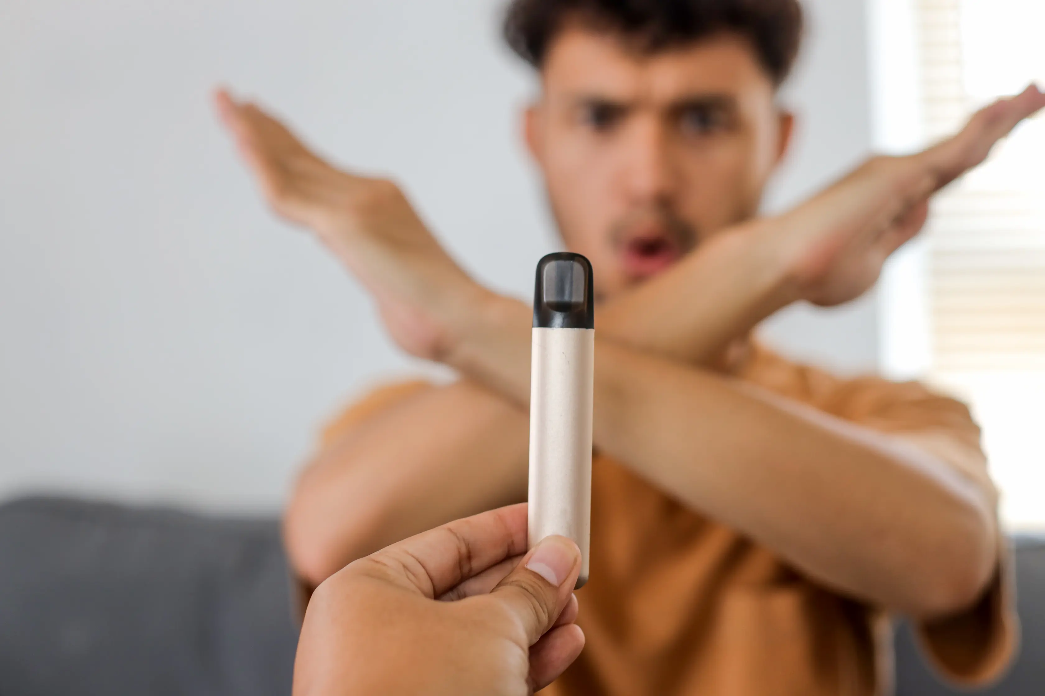 Man rejecting a disposable vape device